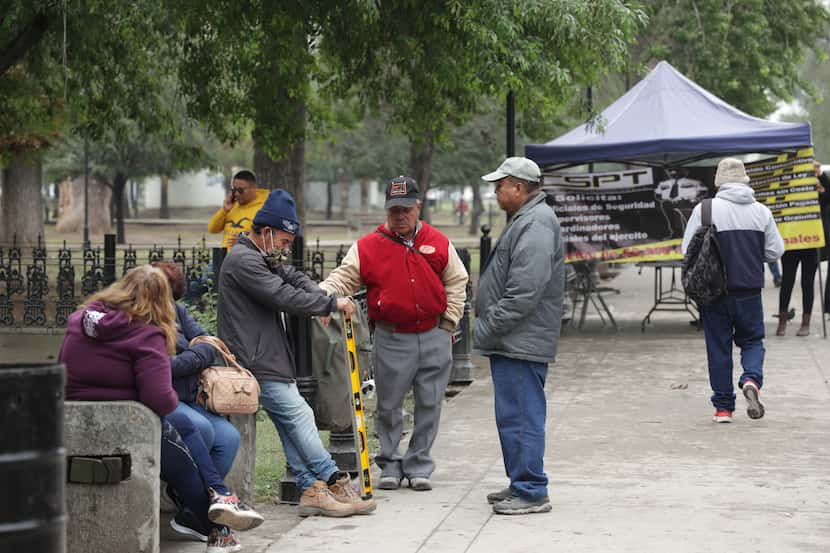 Migrants and city dwellers flock to Plaza La Alameda in Monterrey, Mexico, looking for jobs...