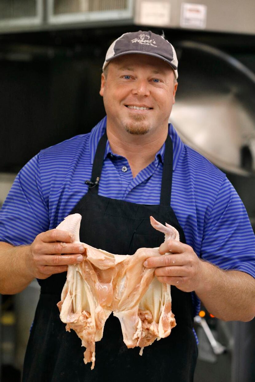 Brian Marcott prepares  a  deboned stuffed chicken at Hebert’s in Addison.