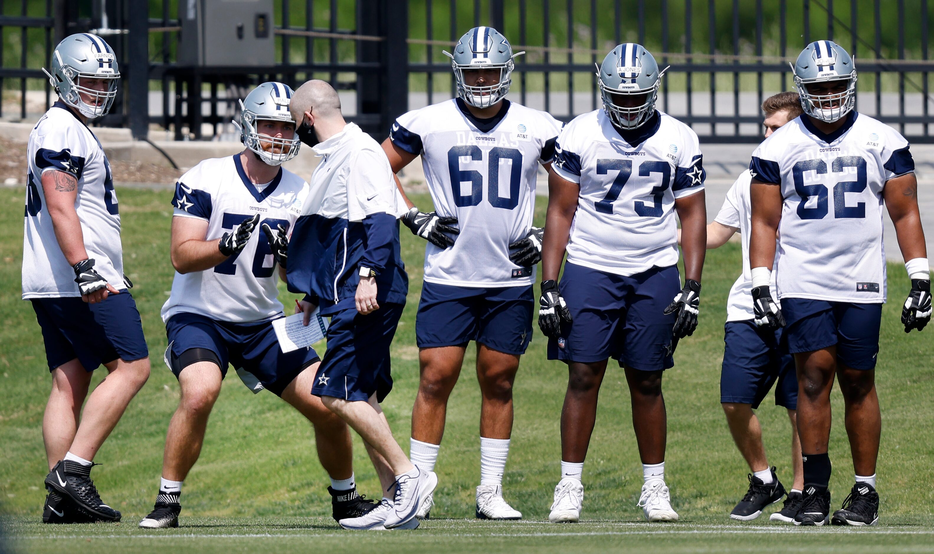 Dallas Cowboys rookie tackle Josh Ball (76) runs through individual drills during rookie...