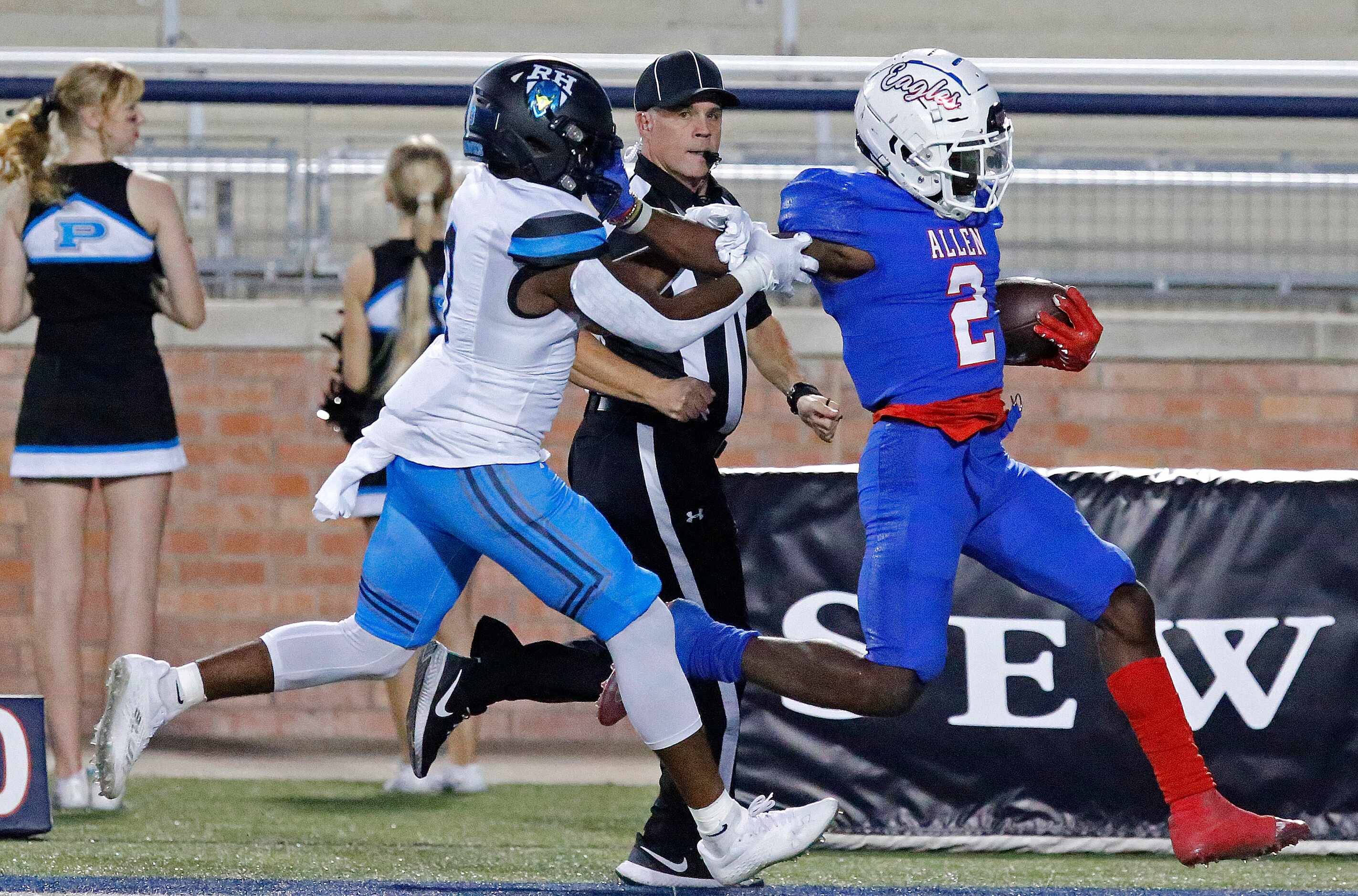 Allen High School running back Kayvion Sibley (2) stiff arms Rock Hill High School defensive...