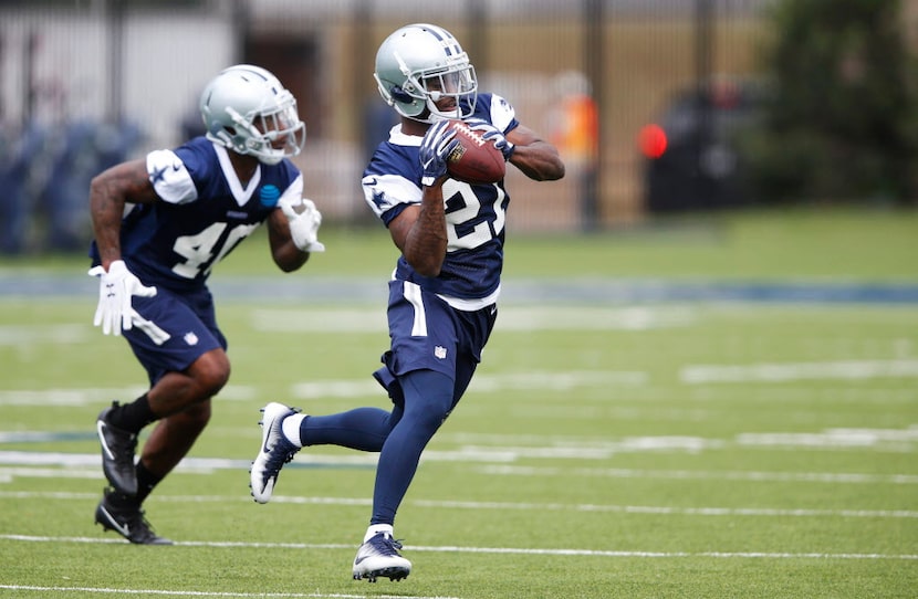 Dallas Cowboys cornerback Jourdan Lewis (27) catches the ball in a drill in rookie minicamp...