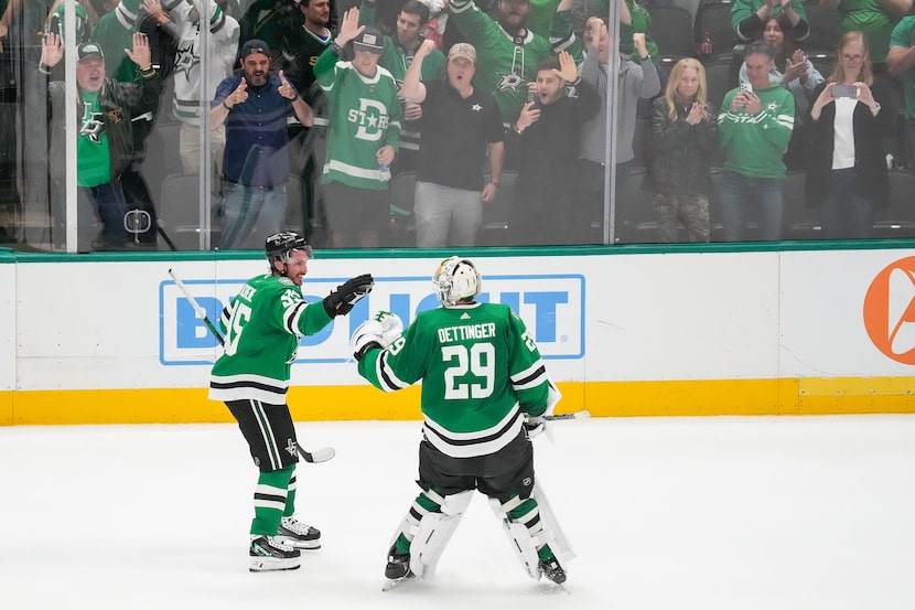 Dallas Stars goaltender Jake Oettinger (29) celebrates with center Matt Duchene (95) after...