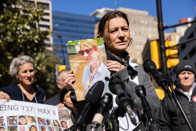 Catherine Berthet holds a photo of her daughter, Camille Geoffroy, after she and other...