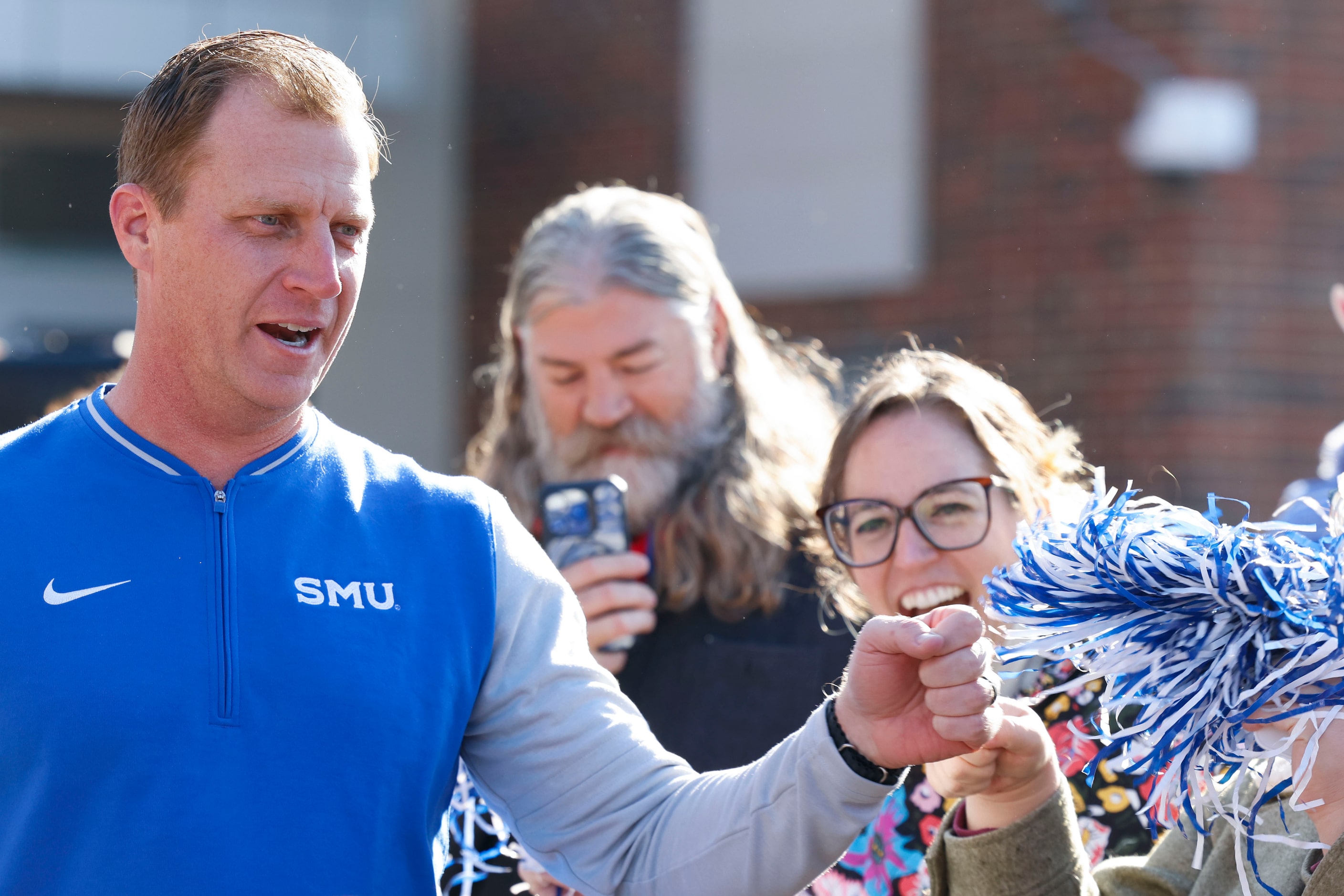 SMU head coach Rhett Lashlee greets the fans during a send-off party for the football team...