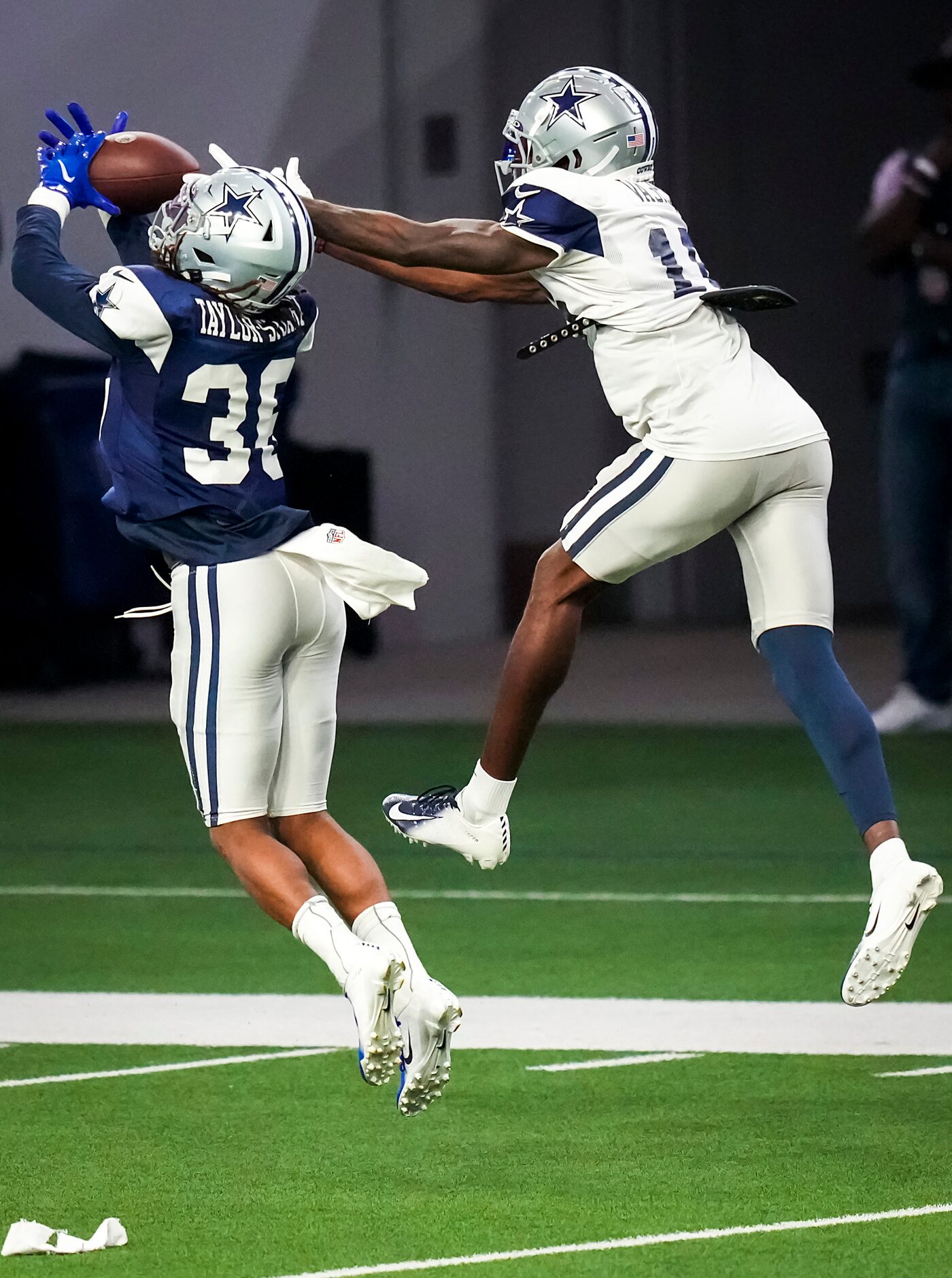 Dallas Cowboys cornerback Isaac Taylor-Stuart (36) intercepts a pass intended for wide...