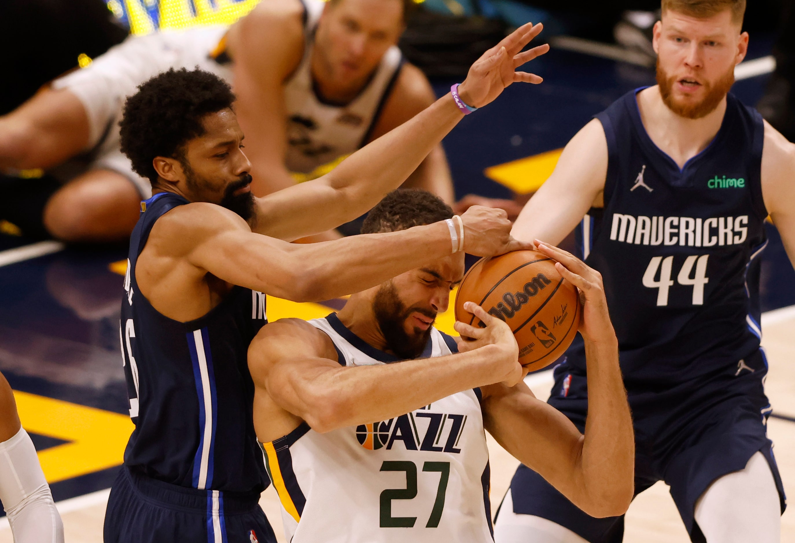 Dallas Mavericks guard Spencer Dinwiddie (26) and Utah Jazz center Rudy Gobert (27) go after...