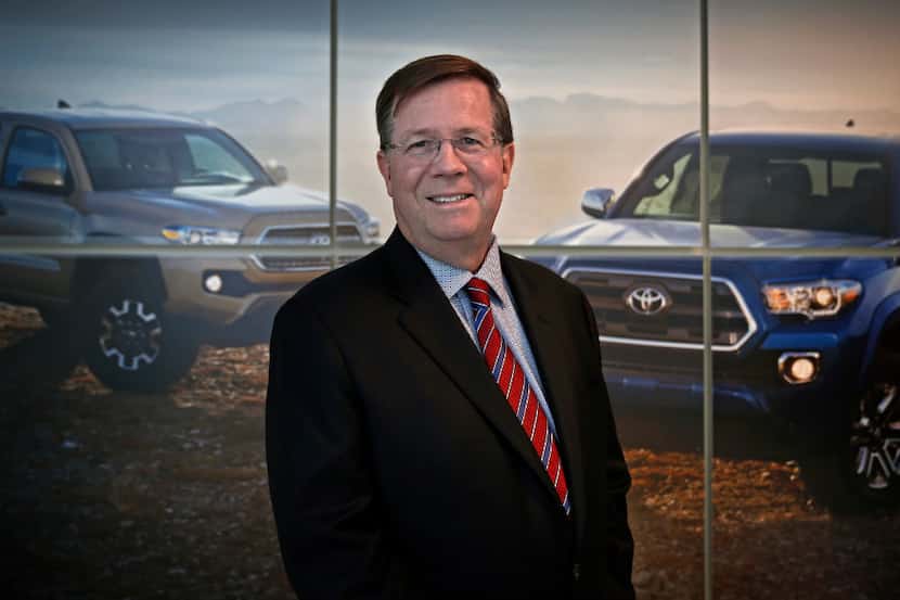 Jim Lentz, CEO of Toyota North America, poses for a portrait in front of a advertising...
