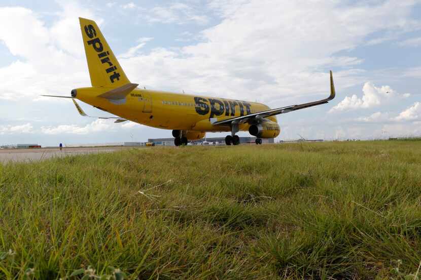 Spirit Airlines airplane taxis at DFW International Airport on Wednesday, August 23, 2017....