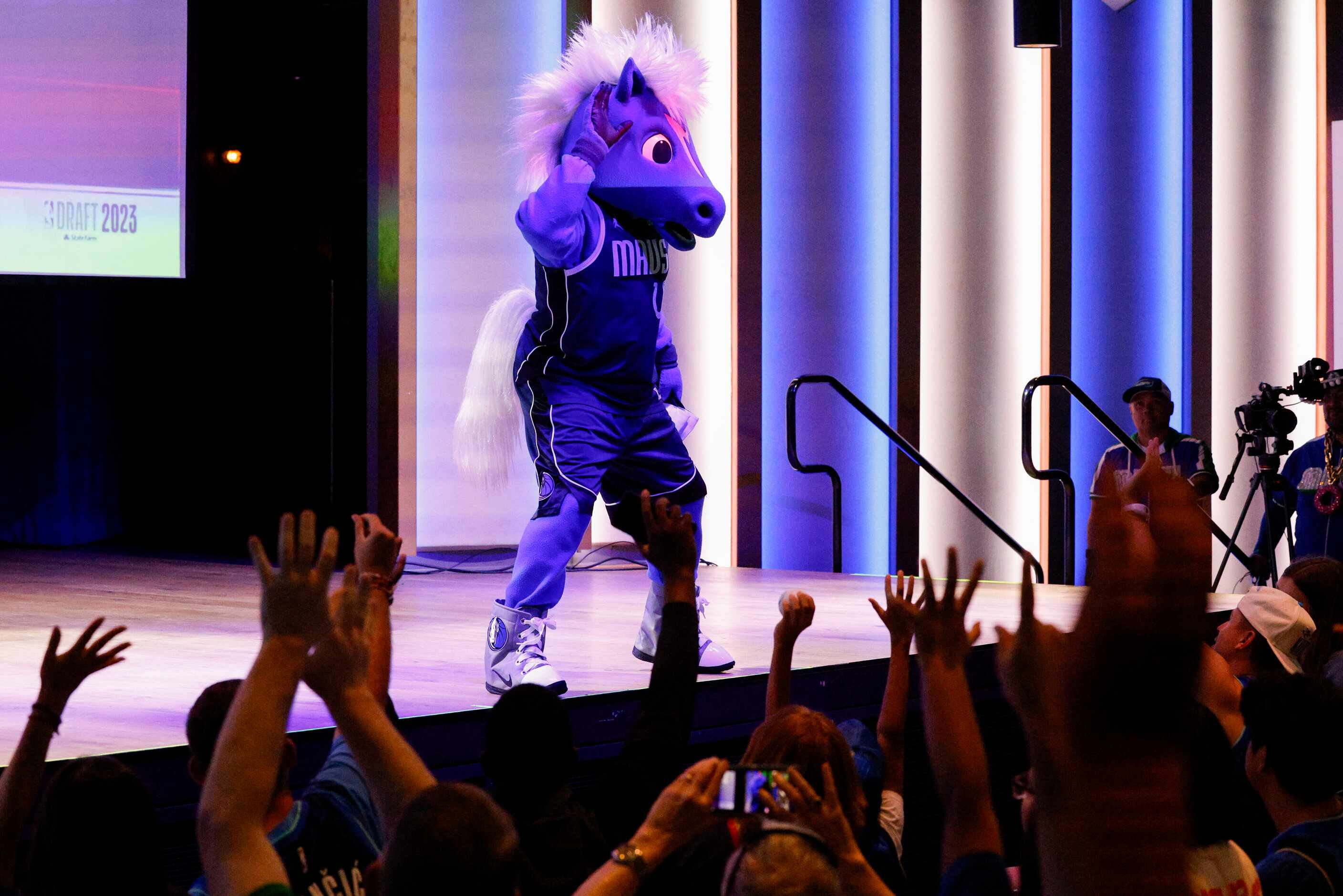 Dallas Mavericks mascot Champ pumps up the crowd before throwing a hat during a 2023 NBA...