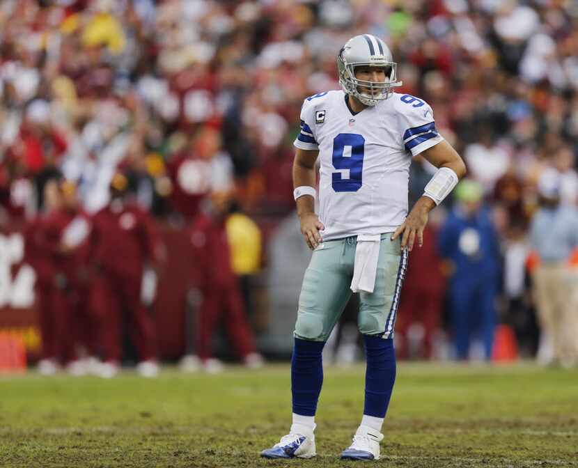 Dallas Cowboys quarterback Tony Romo (9) waits for a play to be called during the first half...