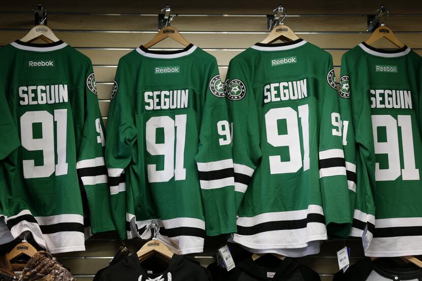 Jerseys of Dallas Stars center Tyler Seguin hang while Seguin meets fans at Rally House in...