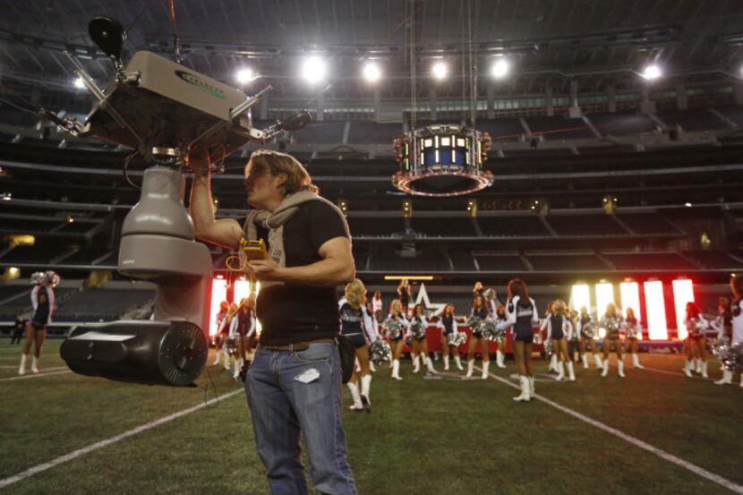Benton Ward of CableCam set up a camera as Dallas Cowboys cheerleaders rehearsed this week...