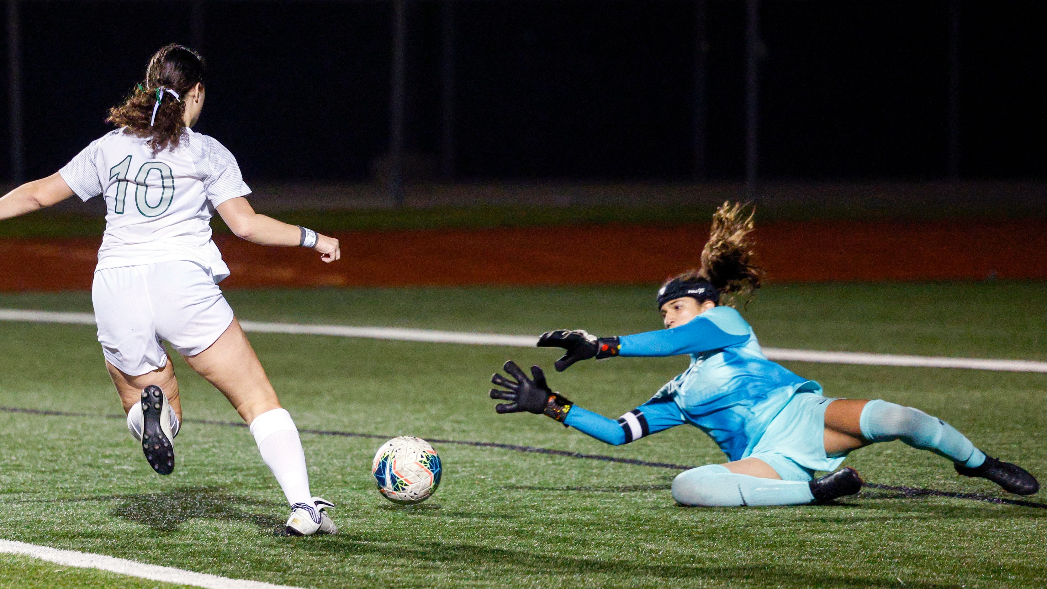 Flower Mound goalkeeper Maya Cordova (1) stops a shot attempt from Prosper midfielder Skyler...