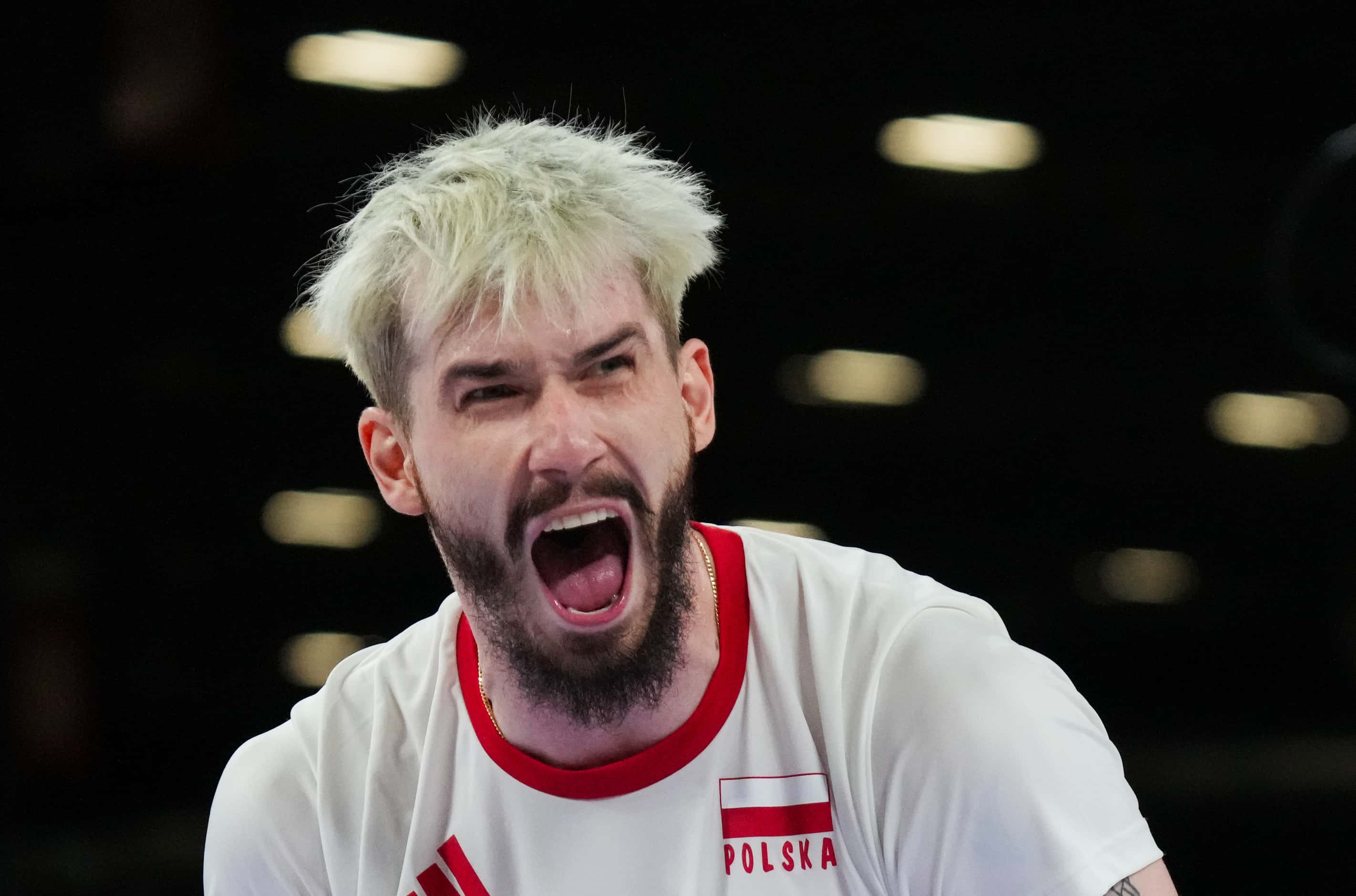 Tomasz Fornal of Poland celebrates after a point during a men’s volleyball semifinal against...