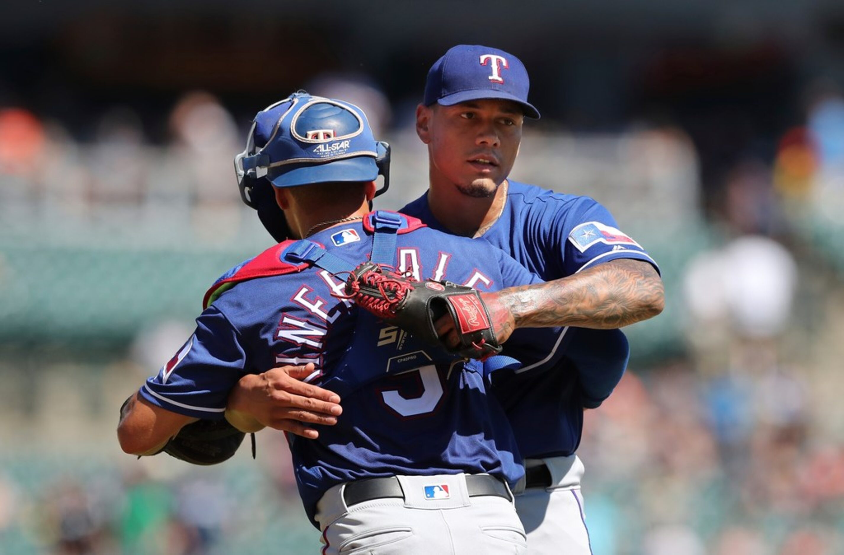 Texas Rangers relief pitcher Keone Kela, right, hugs catcher Isiah Kiner-Falefa after their...