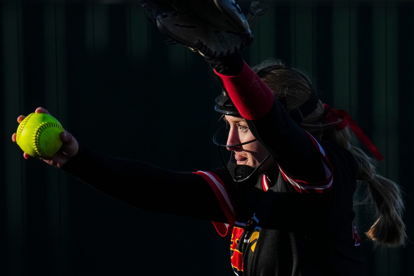 Melissa pitcher Alex Starr delivers during the first inning of a high school softball game...