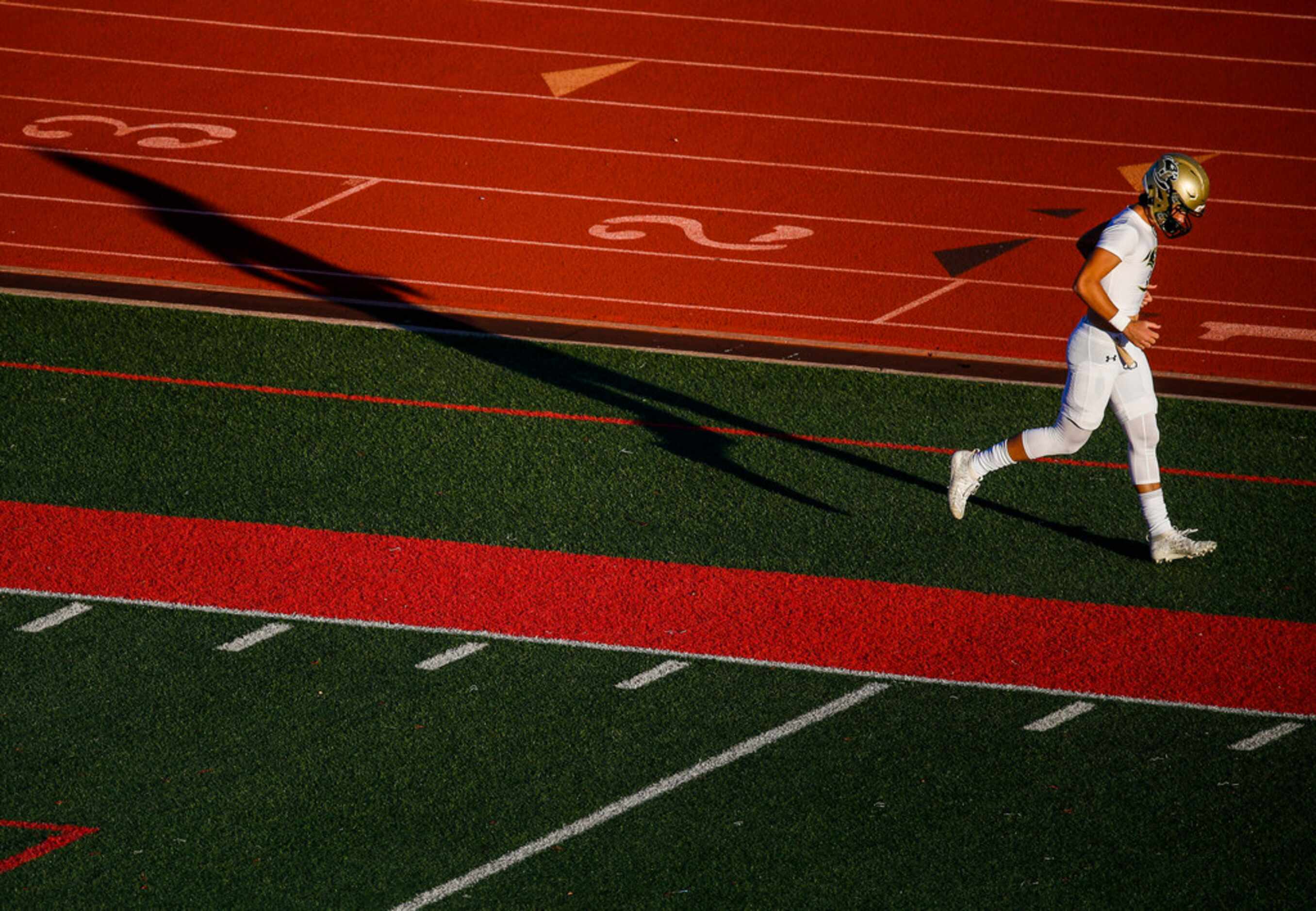 Birdville players warm up prior to a high school football game between Colleyville Heritage...