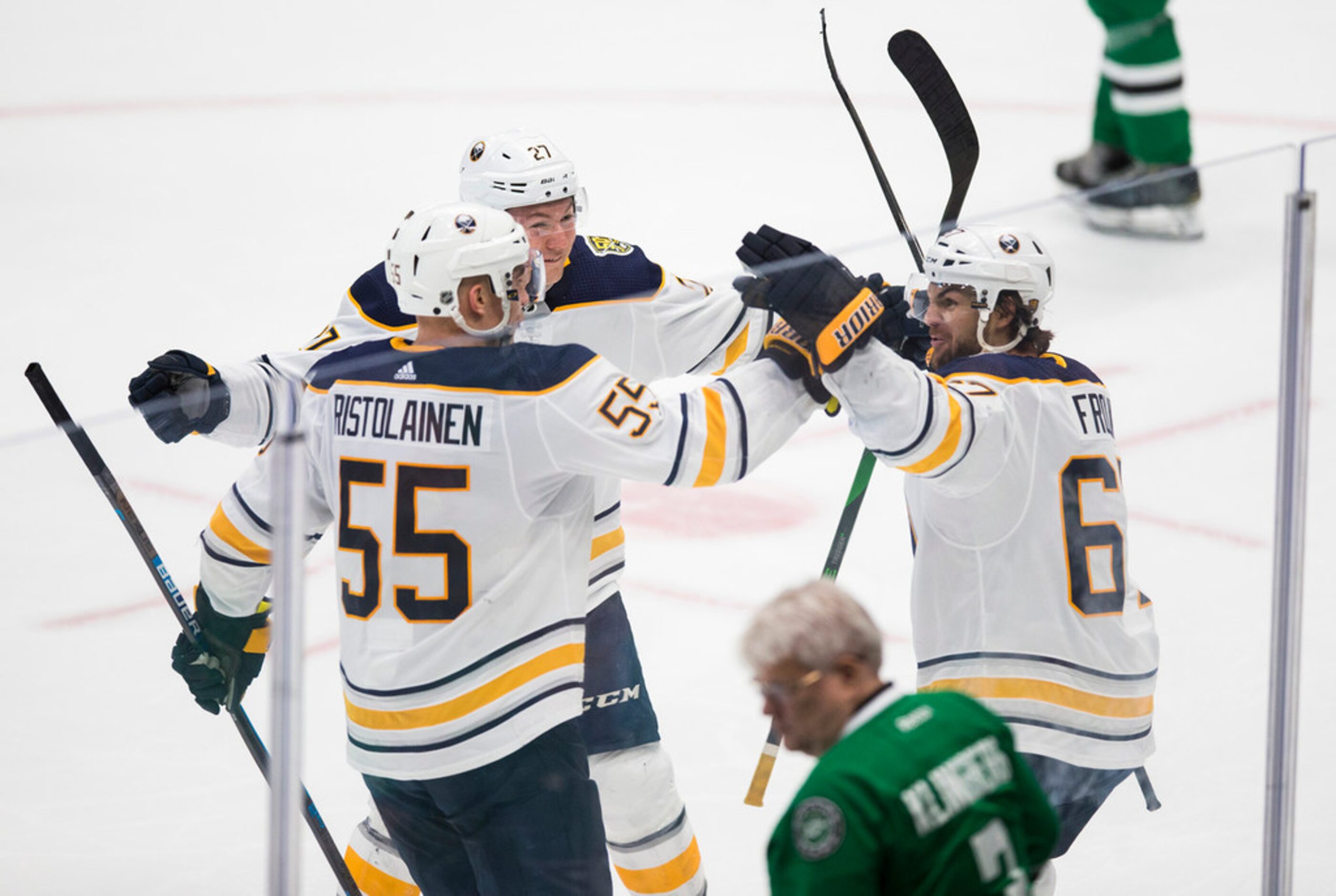 The Buffalo Sabres' Curtis Lazar (27) celebrates a goal with teammates Rasmus Ristolainen...