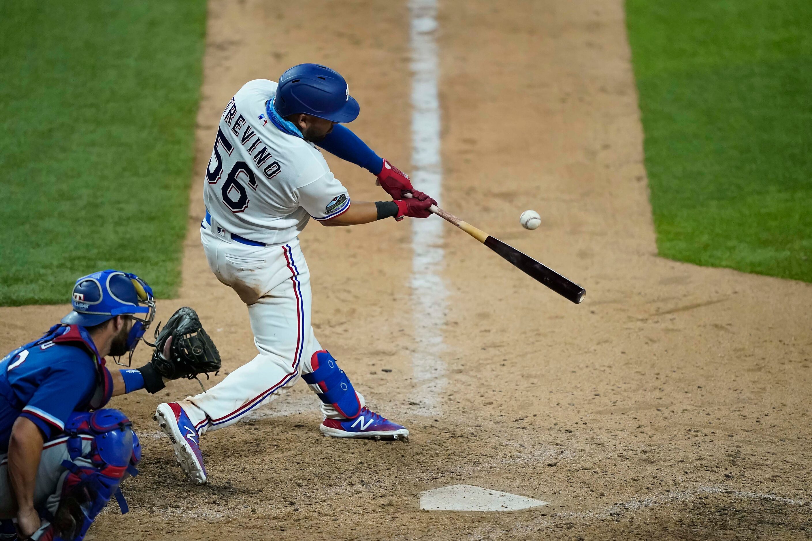 Catcher Jose Trevino bats in an intrasquad game during Texas Rangers Summer Camp at Globe...