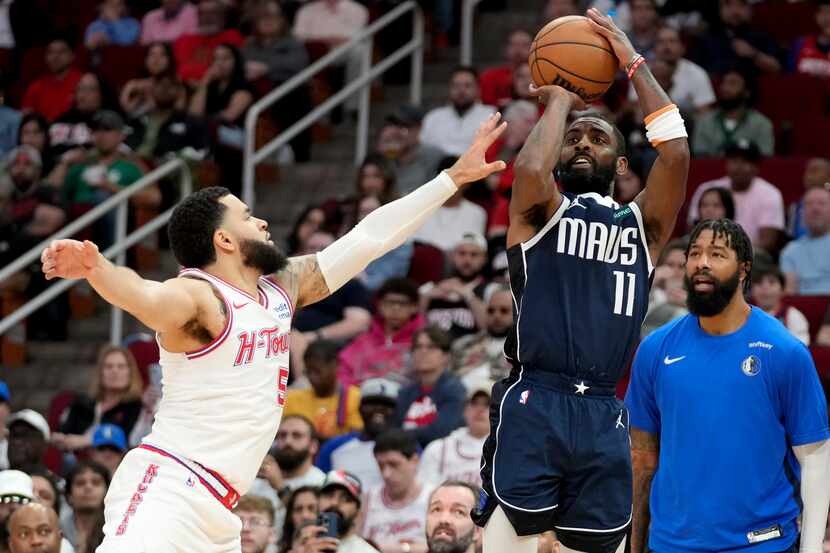 Dallas Mavericks guard Kyrie Irving (11) shoots as Houston Rockets guard Fred VanVleet...