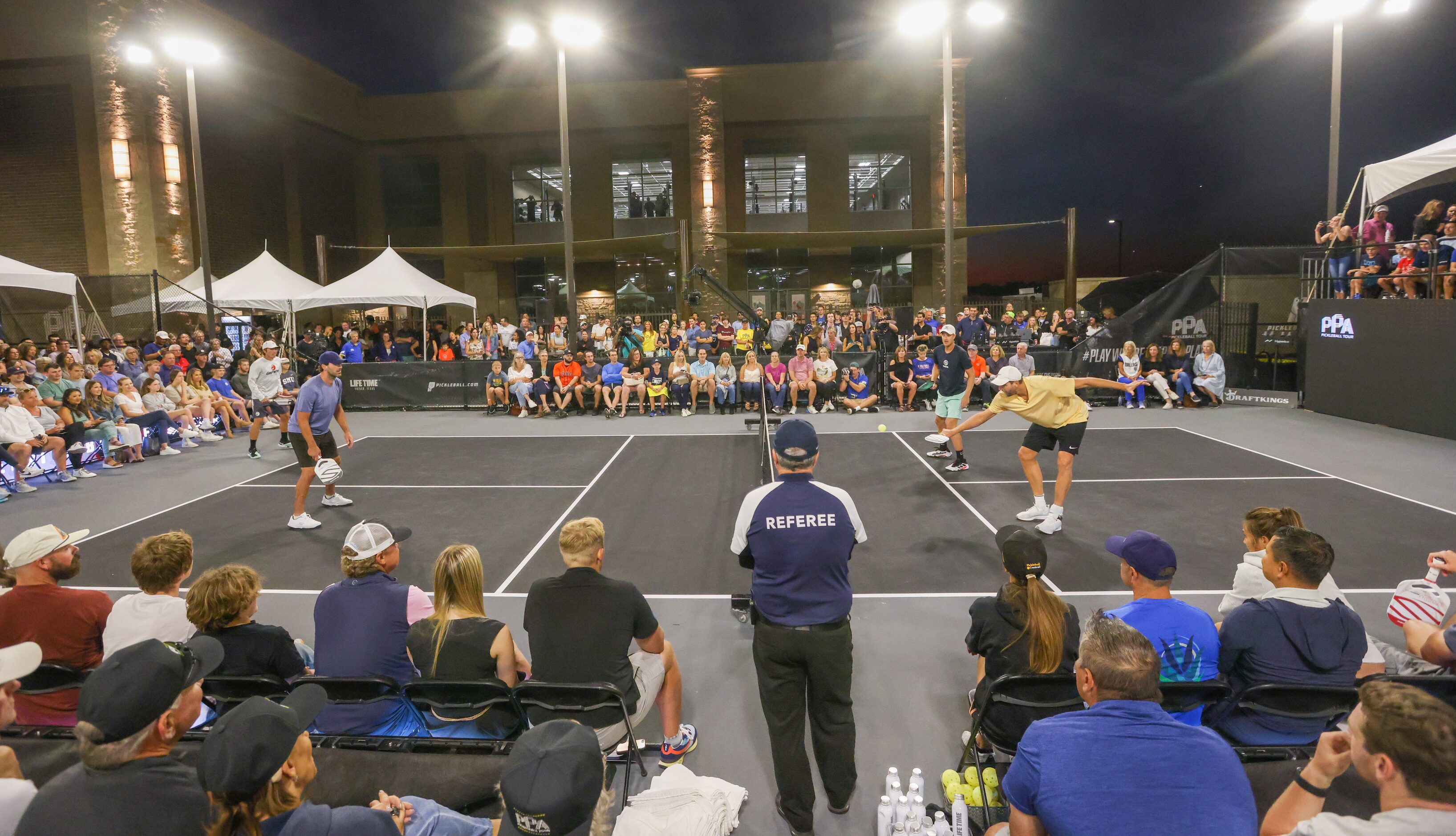 Spencer Smith (left to right), Tony Romo, Riley Newman and Dirk Nowitzki (right) play a...