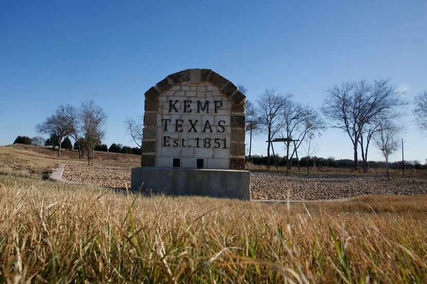 A stone marker stands at the exit from U.S. Highway 175 to Kemp, where a religious...