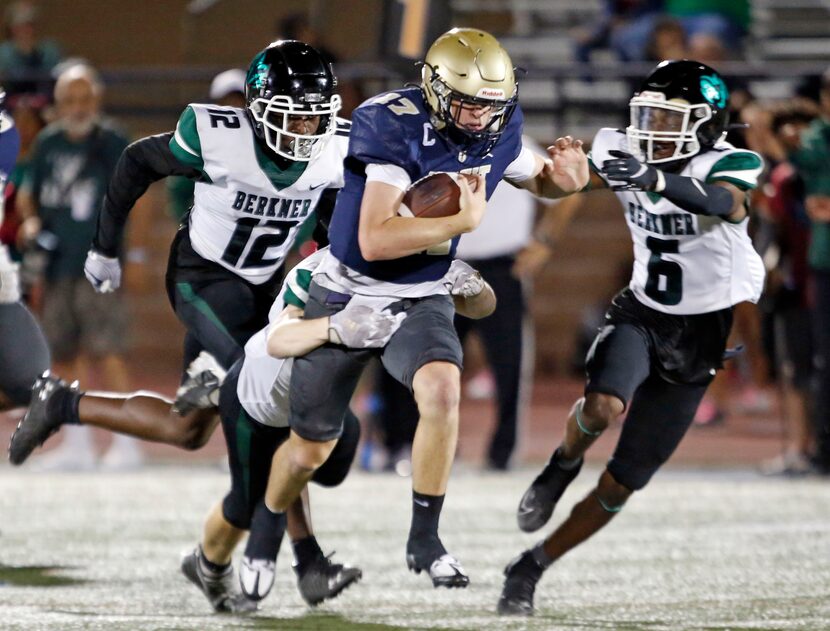 Jesuit QB Charlie Schmidt (17) cuts through the Richardson Berkner defense in route to a...