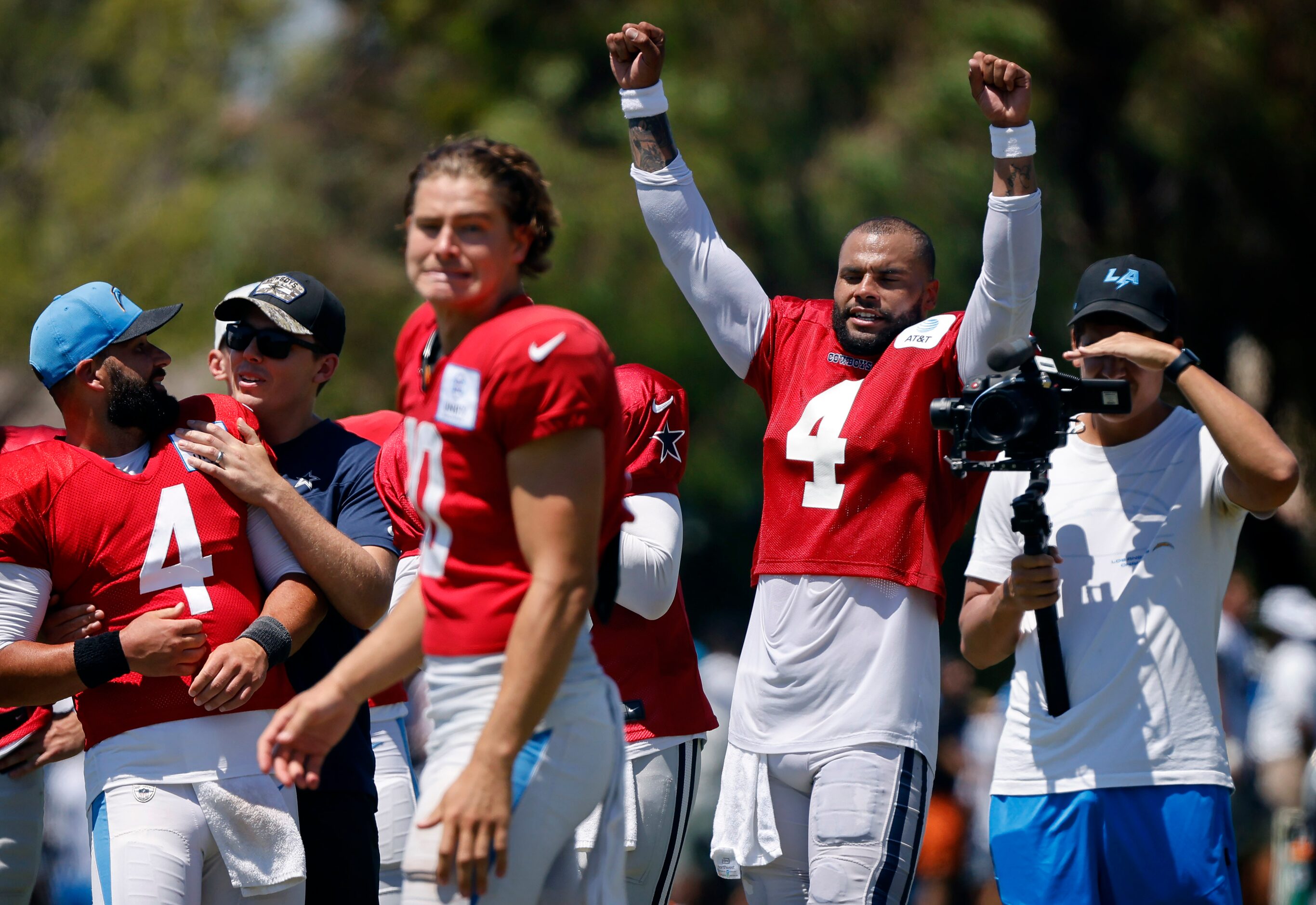 Dallas Cowboys quarterback Dak Prescott (4) raises arms thinking the throw by Los Angeles...