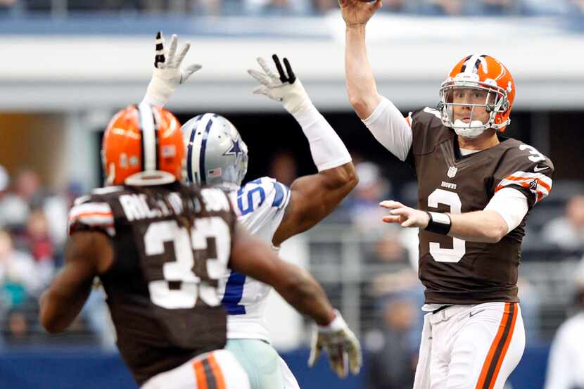 Cleveland Browns quarterback Brandon Weeden (3) passes the ball to Cleveland Browns...