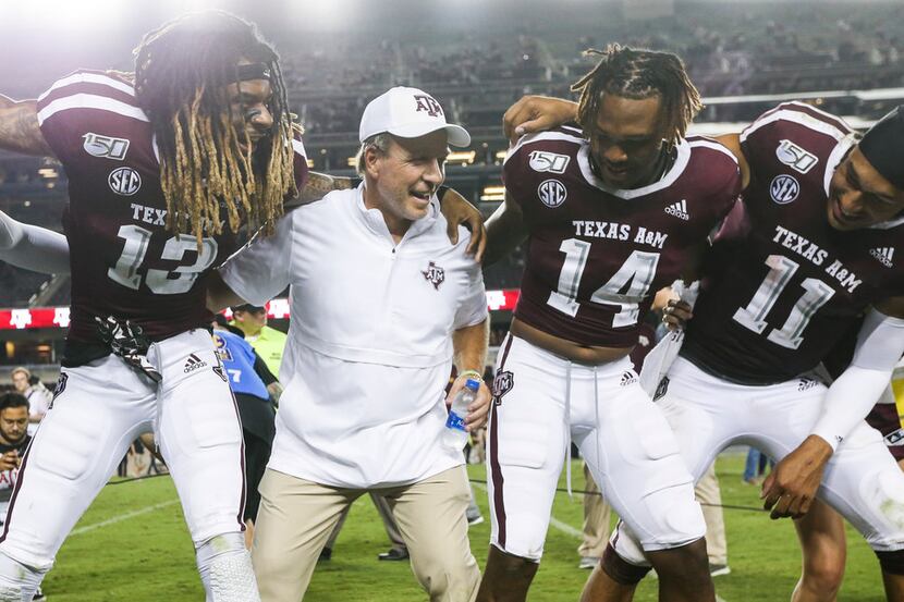 Texas A&M Aggies wide receiver Kendrick Rogers (13), head coach Jimbo Fisher, wide receiver...