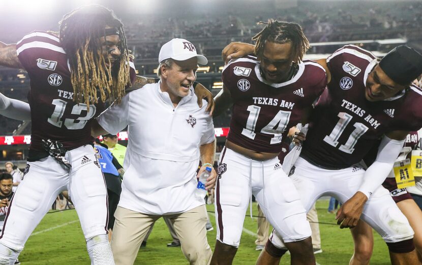 Texas A&M Aggies wide receiver Kendrick Rogers (13), head coach Jimbo Fisher, wide receiver...