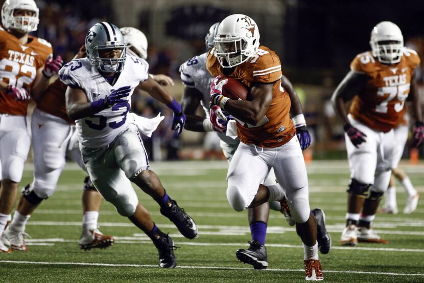Sep 21, 2013; Austin, TX, USA; Texas running back Johnathan Gray (32) rushes past Kansas...
