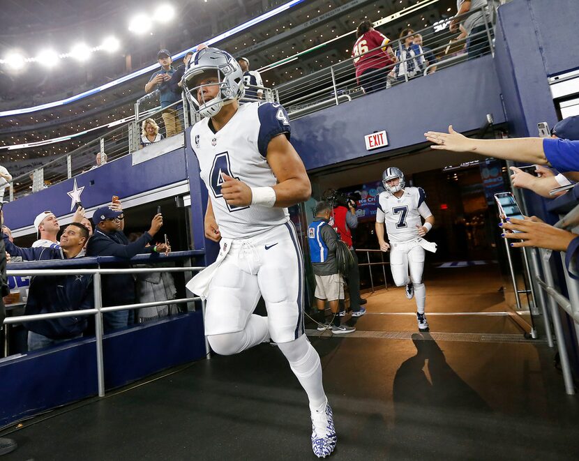 Dallas Cowboys quarterbacks Dak Prescott (4) and Cooper Rush (7) take the field to warm up...