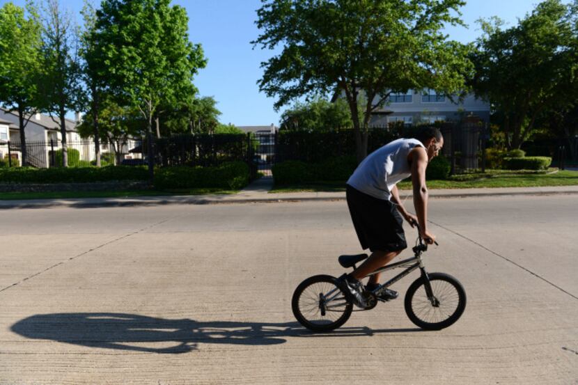 Jacob Blaylock rides his bike along Timberglen Road in Dallas. The area ranks No. 1 for...