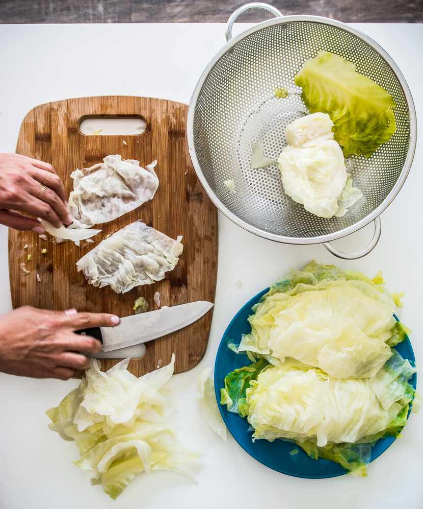 Tamara Abuomar prepares cabbage in her kitchen in Plano.