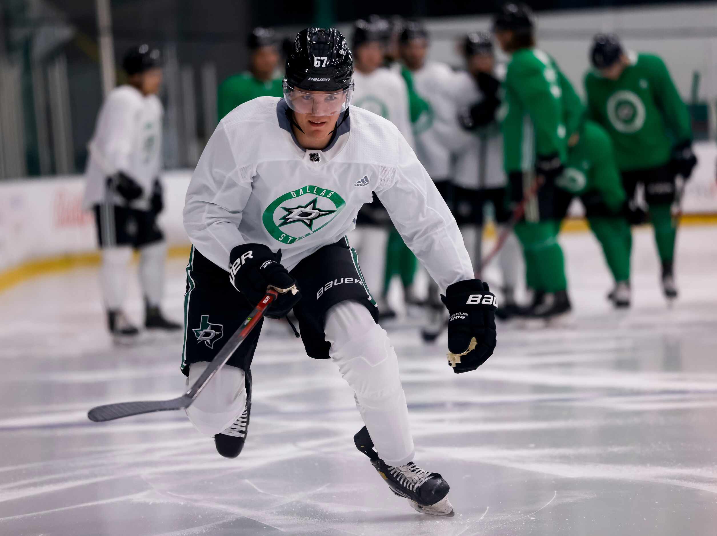P.J. Fletcher (67) participates in a drill during the Stars’ annual development camp Group A...