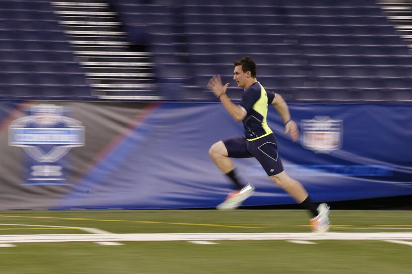 Feb 23, 2014; Indianapolis, IN, USA; Texas A&M quarterback Johnny Manziel runs the 40 yard...