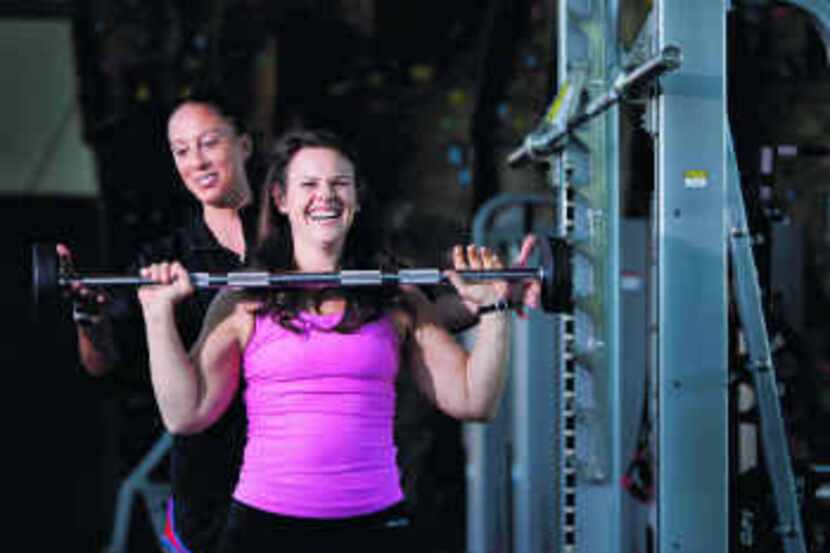  Tracey Yukich says trainer Kristin Johnson (background) stuck with her, helping her 'change...