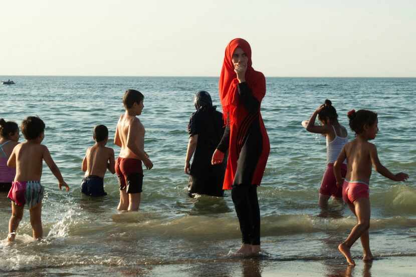 Algerians gathered on a public beach reserved for families in the capital of Algiers in...