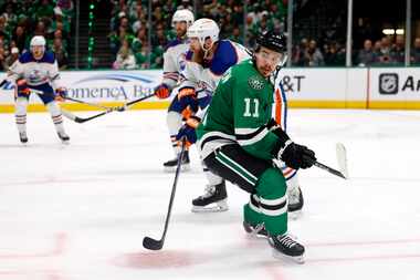 Dallas Stars center Logan Stankoven (11) watches the puck as he skates back during the third...
