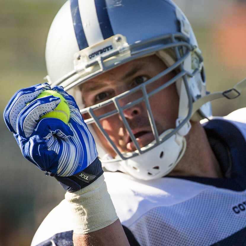 Dallas Cowboys tight end Jason Witten catches a tennis ball thrown to him in a drill during...