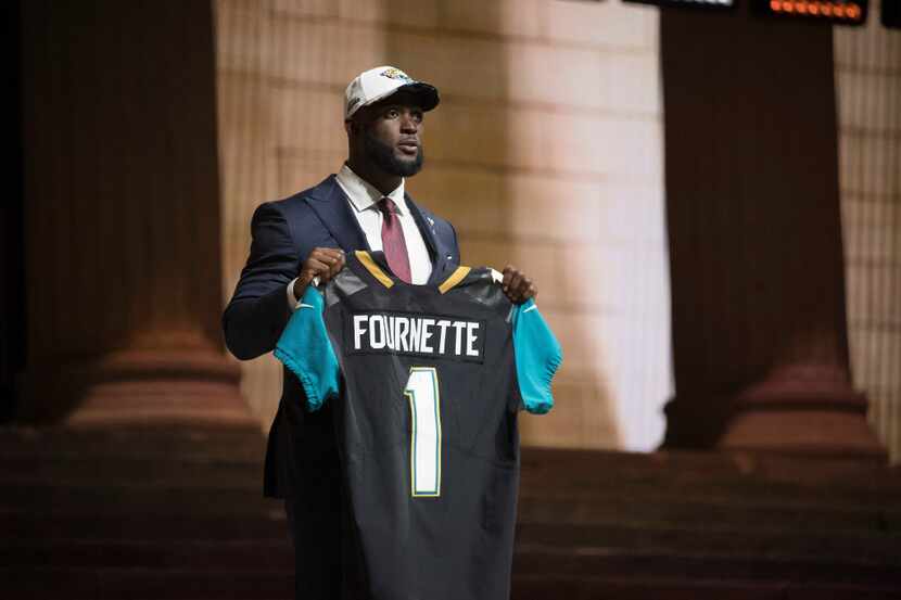 Leonard Fournette, a running back from Louisiana State University, is selected fourth...