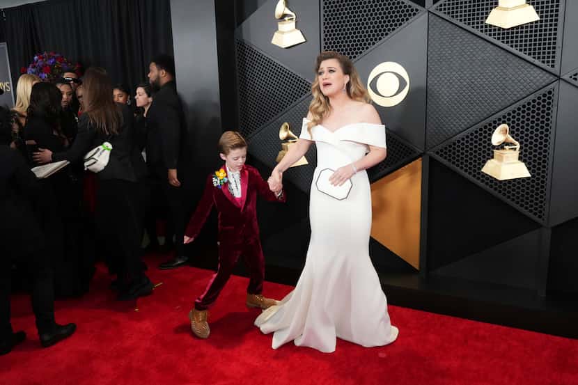 Remington Blackstock, left, and Kelly Clarkson arrive at the 66th annual Grammy Awards on...