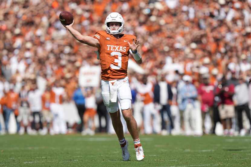 Texas quarterback Quinn Ewers (3) throws a pass during the first half of an NCAA college...