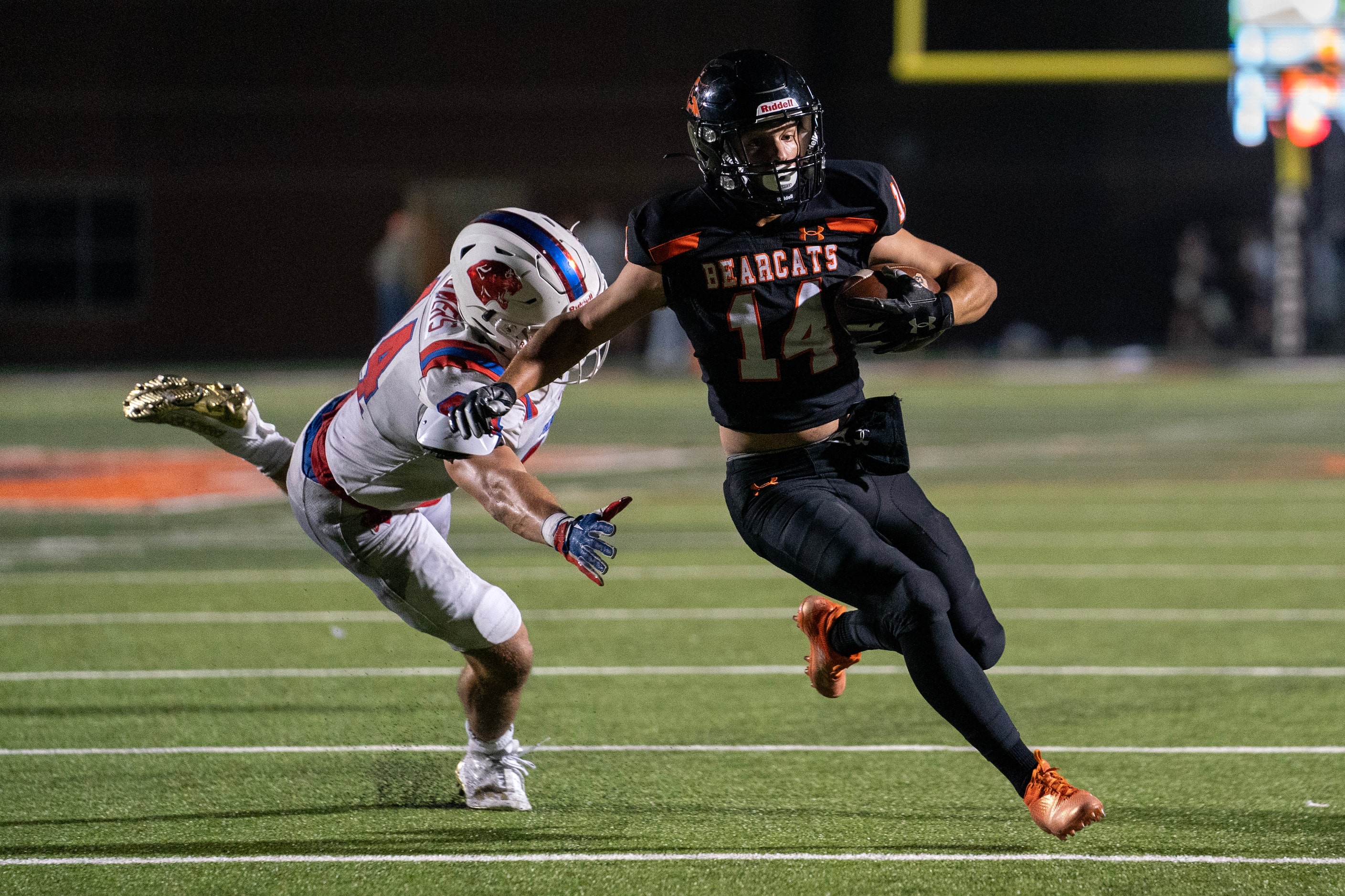 Aledo junior wide receiver Blake Burdine (14) eludes Parish Episcopal senior linebacker...