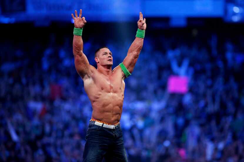John Cena celebrates his win during Wrestlemania XXX at the Mercedes-Benz Super Dome in New...