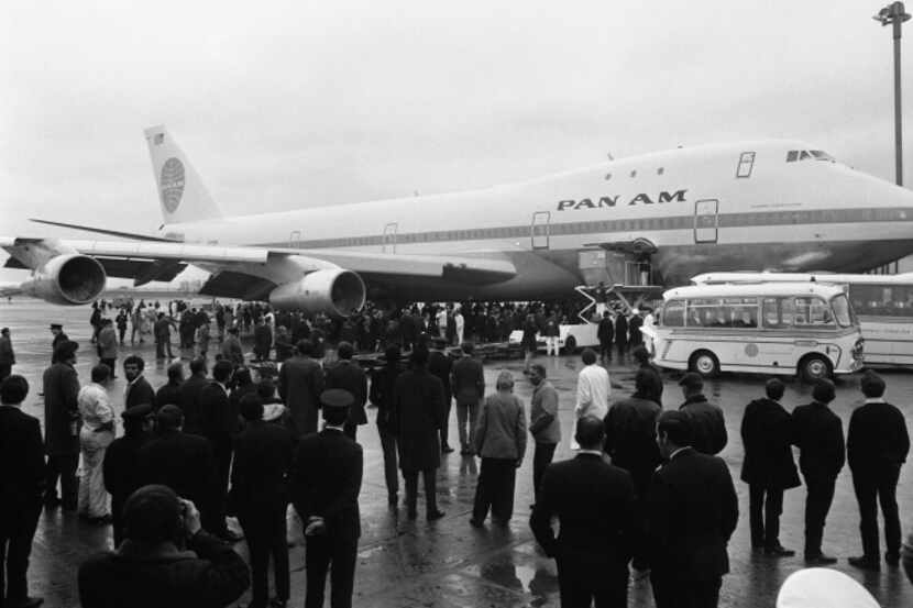 A crowd gathered at London's Heathrow Airport after a Pan Am Boeing 747 Jumbo Jet arrived...