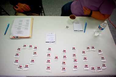  Voter stickers spelled out Ohio at a polling place at Harmony Chapel United Methodist...