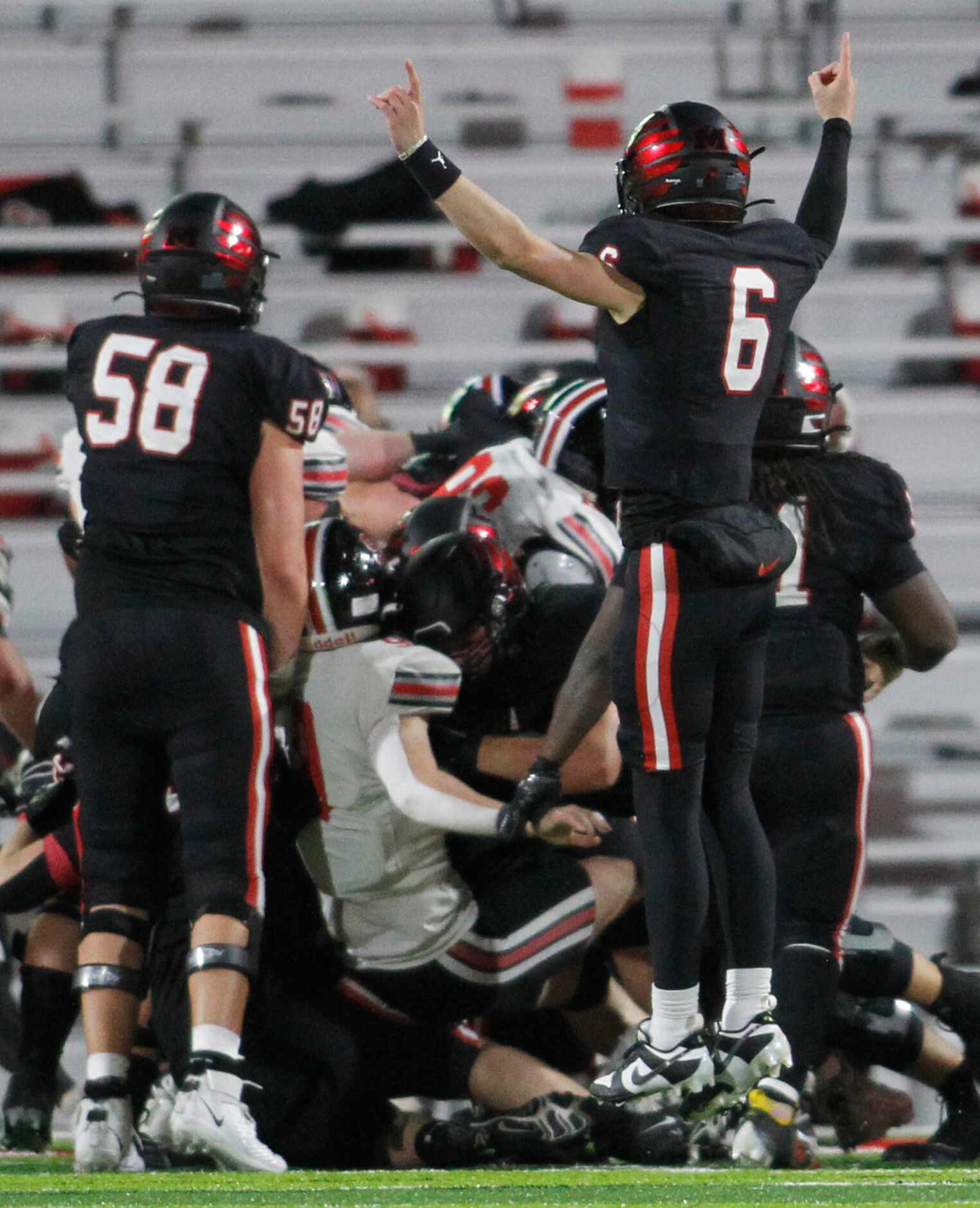 Melissa quarterback Trever Ham (6) leaps in celebration of  a Cardinals touchdown late in...