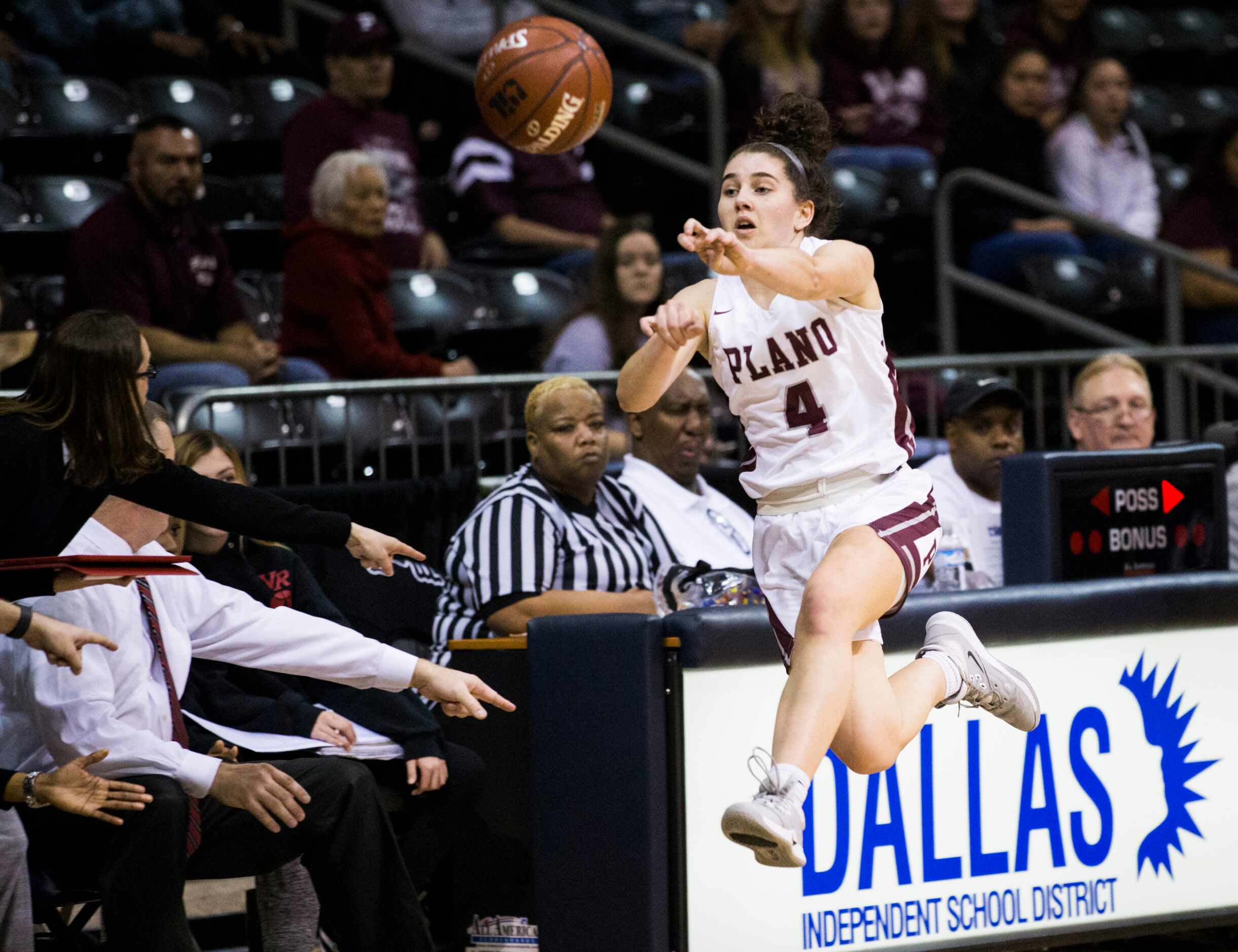 Plano guard Maggie Robbins (4) jumps out of bounds during the first quarter of a UIL 6A...
